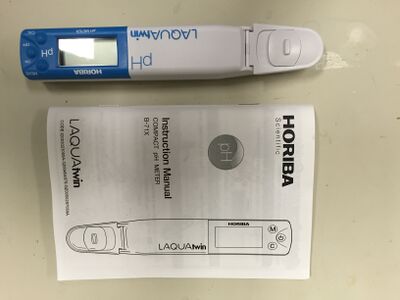Handheld pH meter.