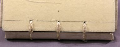 Cord sewing supports run across the outside of a board and laced into pre-drilled holes