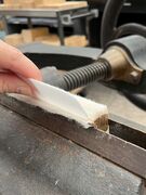 Leaves being individually folded over at the spine edge to match the original backed shape.