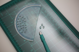 Agarose gel pellets pictured with a 4mm Miltex® biopsy punch. Treatment solutions including solvents, chelators, enzymes, pH- & conductivity-adjusted waters may be tested on a small scale using pellets of rigid gel as the delivery system. Pellets of agarose gel can also be used to gather pH and conductivity readings from the surface of an object. See Stavroudis video cited below. photo: Amy Hughes