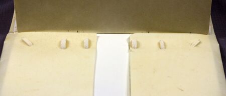 Inside the case, the laced ends of the supports are captured behind extra long head and tail turn-ins. Such bindings may or may not include additional pastedowns.