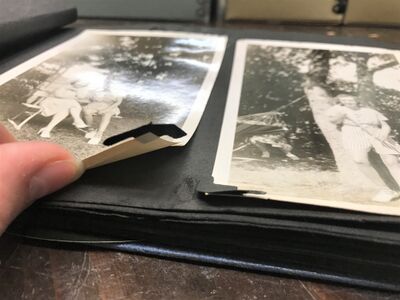 Detail of photo corners delaminating from paper support. Arden Craft Shop Museum.